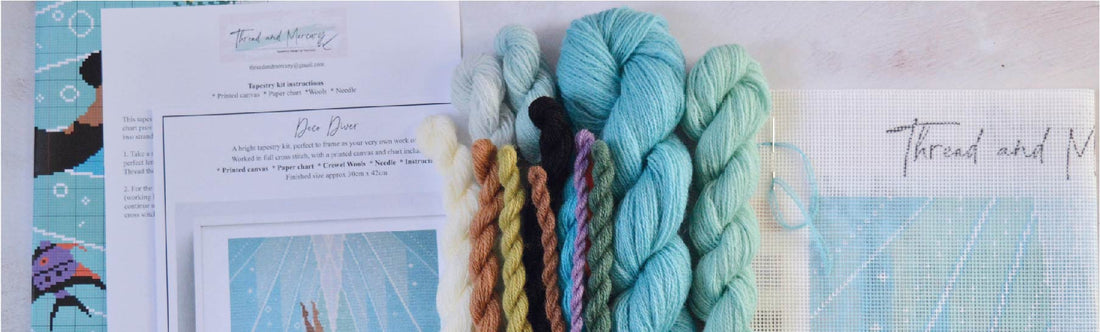 The contents of a tapestry kit including wool and a printed canvas