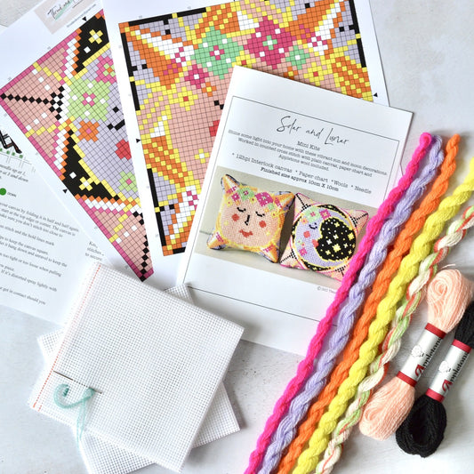 A beginner tapestry kit showcasing a solar and lunar design, with sun and moon motifs stitched in intricate detail, offering a celestial-inspired project for craft enthusiasts.