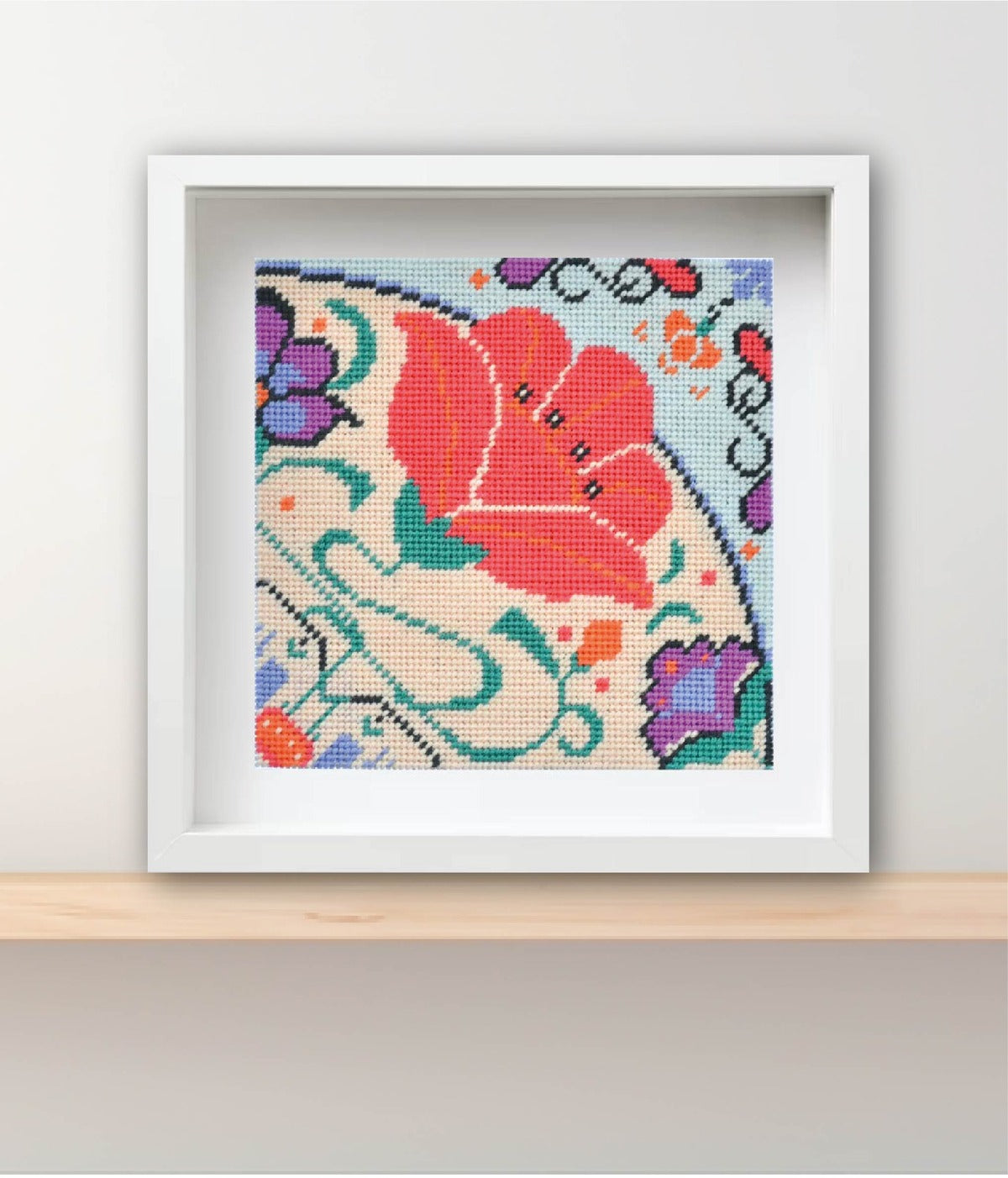 tapestry kit made using brightly coloured wool and framed