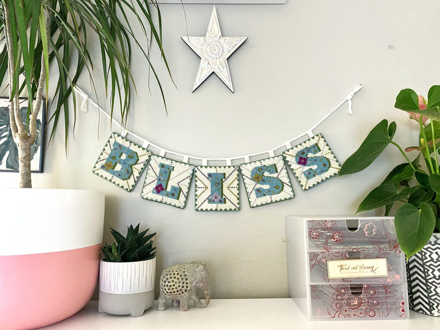 Capture the essence of joy and celebration by making your own bunting decoration with this counted cross stitch tapestry kit. Charming patterns and soft hues flutter gently, infusing any space with whimsy and warmth. Hang this delightful bunting at parties, weddings, or simply to add a touch of cheer to your home decor. With its timeless design and effortless charm, our Bliss Bunting is sure to evoke smiles and create memorable moments wherever it graces.