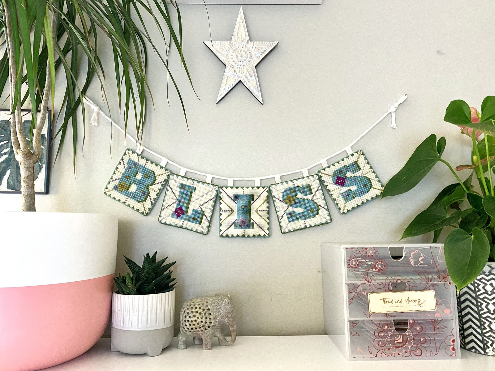 Capture the essence of joy and celebration by making your own bunting decoration with this counted cross stitch tapestry kit. Charming patterns and soft hues flutter gently, infusing any space with whimsy and warmth. Hang this delightful bunting at parties, weddings, or simply to add a touch of cheer to your home decor. With its timeless design and effortless charm, our Bliss Bunting is sure to evoke smiles and create memorable moments wherever it graces.