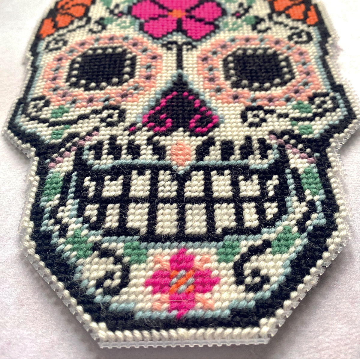stitched day of the dead cross stitch design using plastic canvas