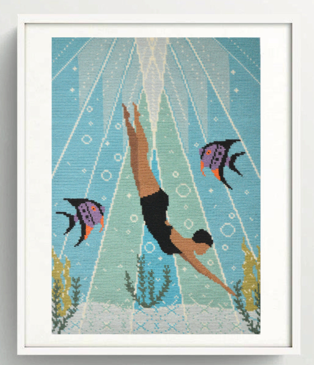A close-up image of a colorful Deco Diver tapestry kit, showcasing intricate underwater scenes, vibrant threads, and intricate stitching patterns on a canvas background.