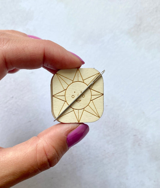 a strong magnetic needle minder with the tapestry needle safely secured.