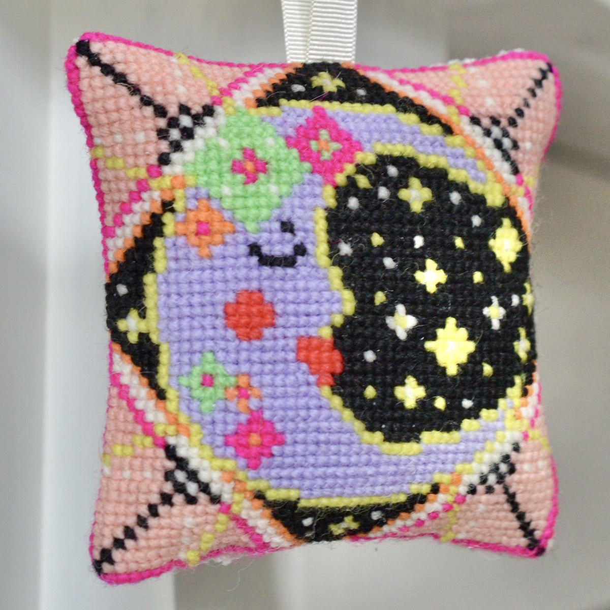 A moon tapestry kit design featuring the serene beauty of the moon against a starry night sky, offering a calming and celestial-themed project for crafters.