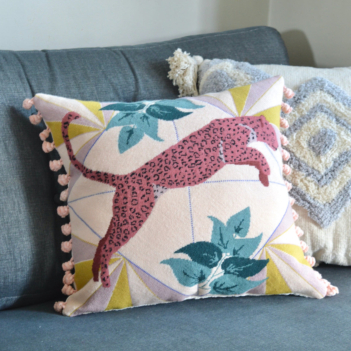 A large needlepoint kit with a printed canvas. Featuring a majestic leopard design, with intricate details and vibrant colors, offering a captivating and challenging project for needlepoint enthusiasts to create a stunning piece of art.