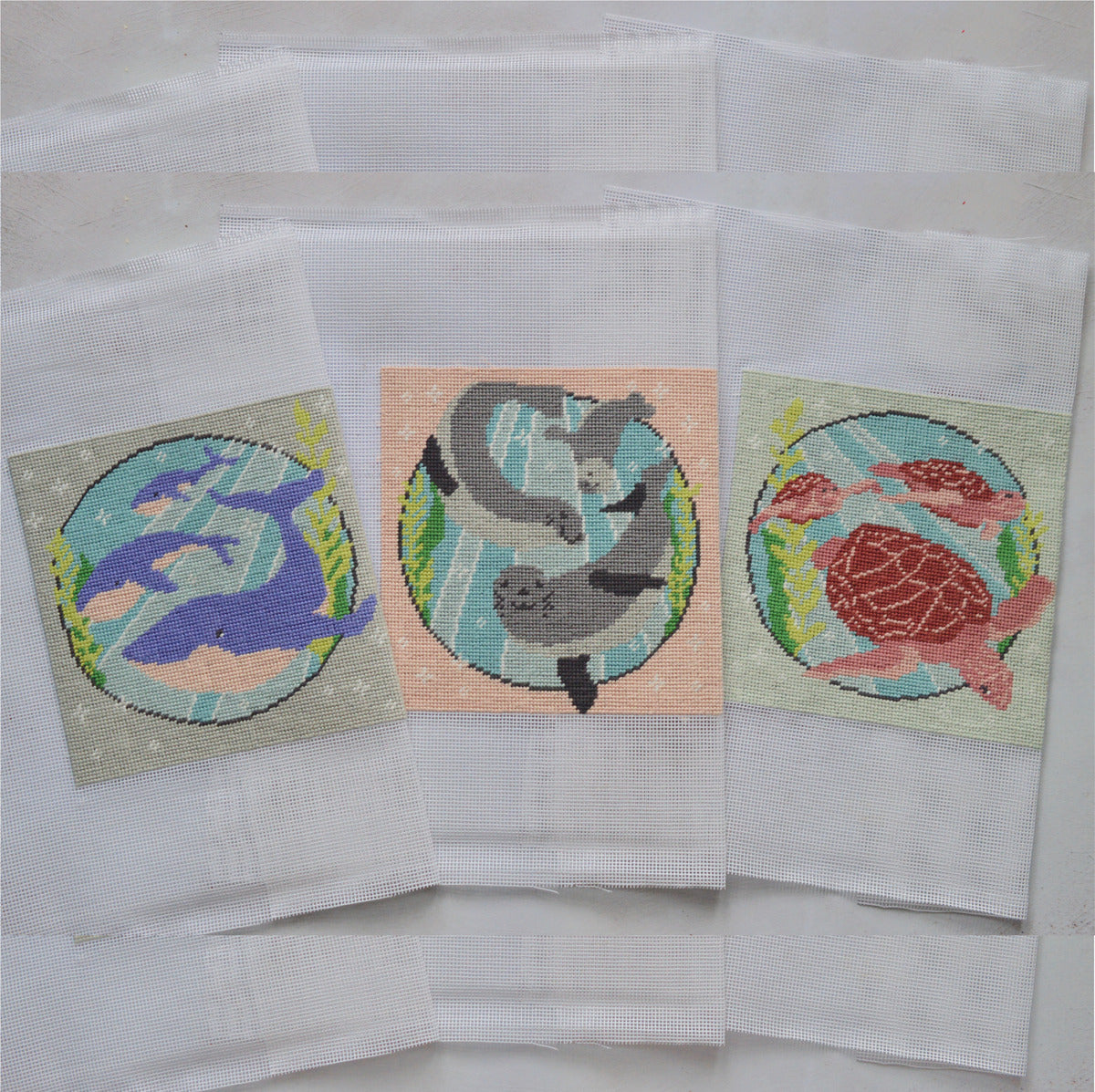 3 finished modern tapestry kits using printed canvas and anchor soft cotton threads.
