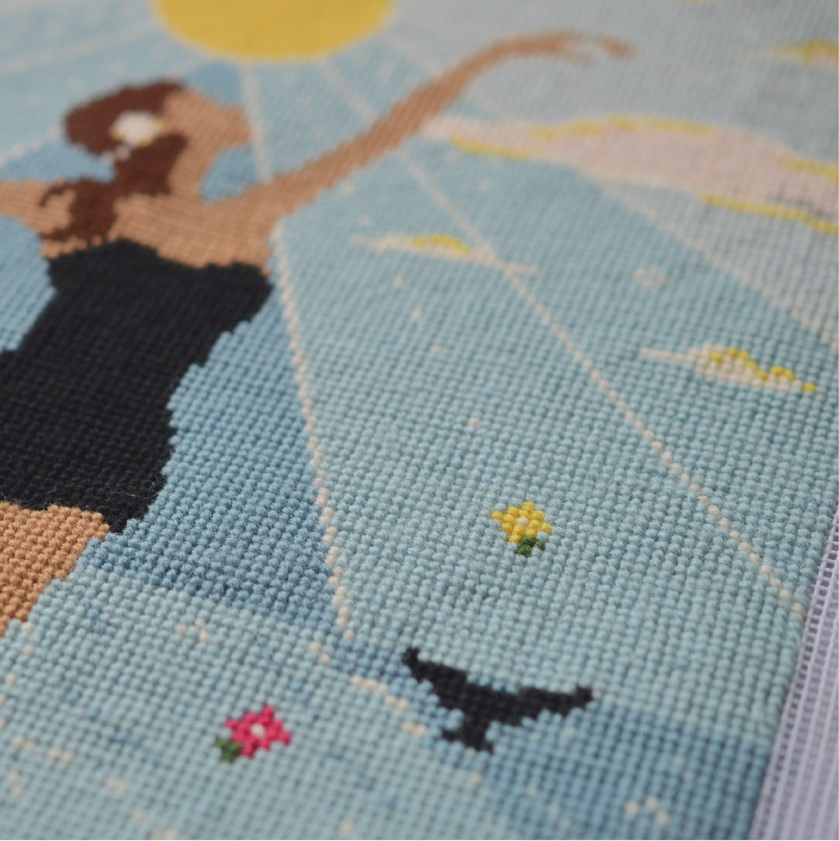 a detailed close up of a modern cross stitch tapestry kit
