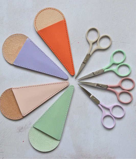 sharp embroidery scissors with a colourful leather case. Choice of colours include orange, lilac, pale pink, mint green.
