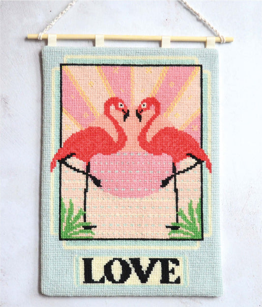 An image of a vibrant flamingo tapestry kit, featuring intricate details and vivid colors. The design showcases a majestic flamingo amidst lush foliage, exuding tropical charm and elegance. Perfect for stitching enthusiasts seeking a captivating project to adorn their space with a touch of nature-inspired beauty.