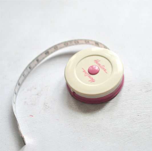 a retractable tape measure with cm and inches