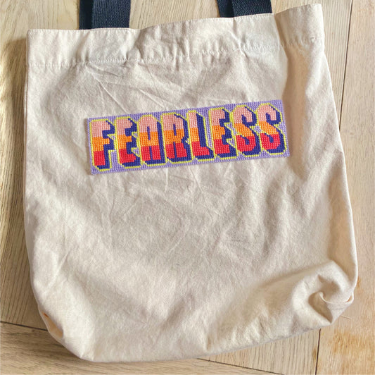 fearless needlepoint downloadable chart stitched onto a tote bag