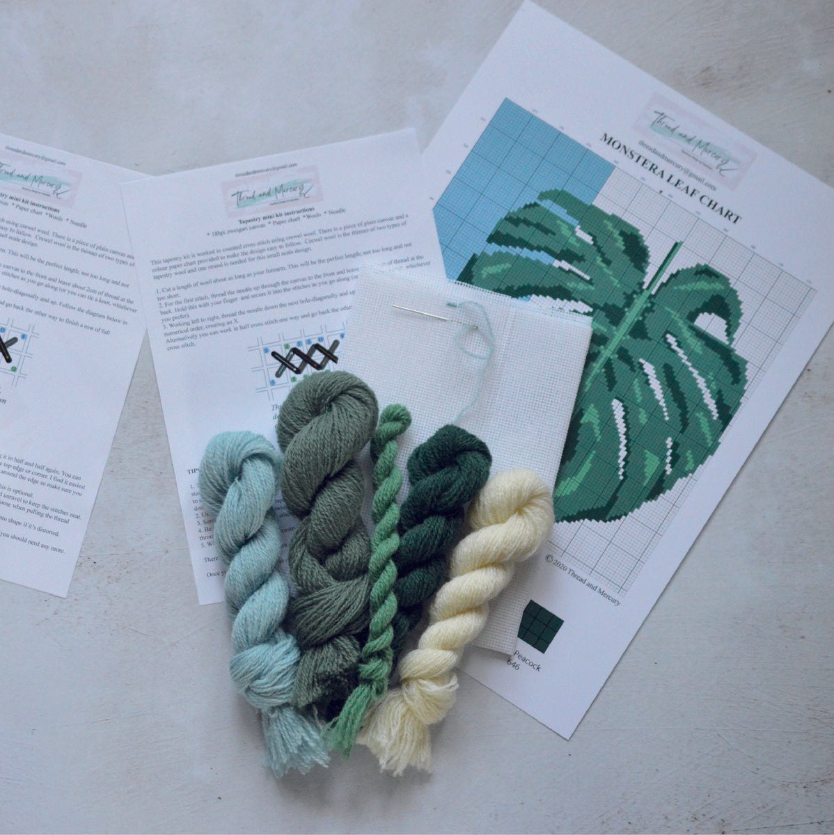 The monstera leaf tapestry kit with plain canvas. Also available in a blue colourway where the background colour is a baby blue colour.