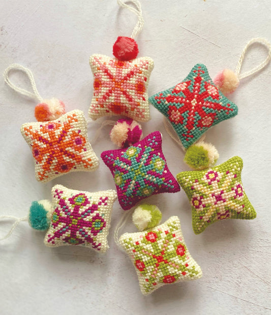 mini snowflake decorations cross stitched using wool. cross stitch design pdf download