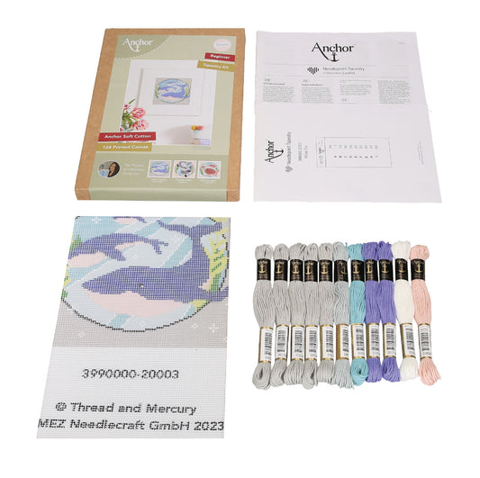 A beginner tapestry kit showing the contents which includes a printed canvas and vibrant colour threads.