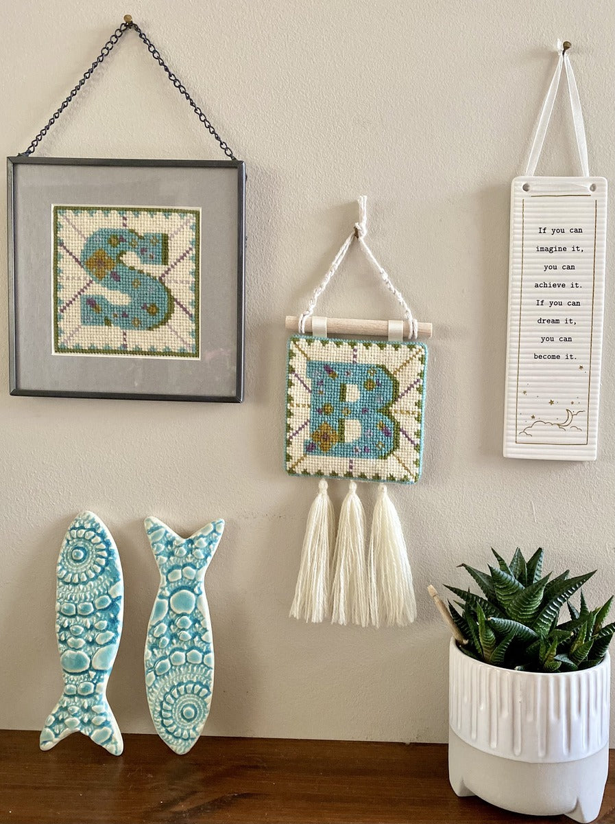 Individual alphabet tapestries showing one option to frame the finished piece and one option to make into a mini wall hanging.