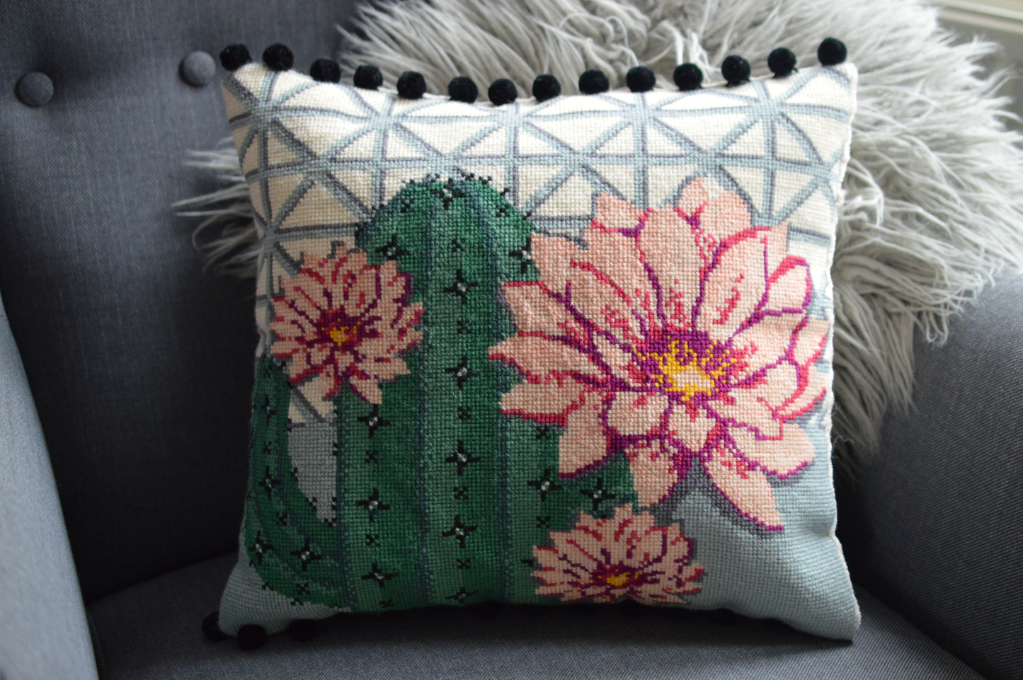 Finished needlepoint cushion cactus flower design